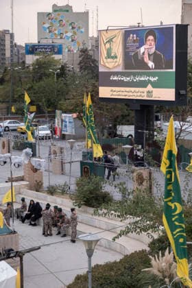 Opening Ceremony Of Second City-Square Military Training Camp Iranian schoolboys wearing military uniforms gather beneath a portrait of Hassan Nasrallah, the late secretary general of Lebanon s Hezbollah, as they prepare to take part in the opening ceremony of the second city-square military training camp for self-sacrificing forces in downtown Tehran, Iran, on October 3, 2026. The camp was established by the Basij paramilitary force, with personnel from the Islamic Republic of Iran Army responsible for training the volunteers. Tehran Tehran Iran  Copyright: xMortezaxNikoubazlx originalFilename: nikoubazl-openingc261003_nplnR.jpg
