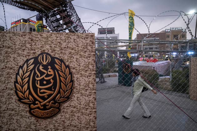 Daily Life Around A City-Square Military Training Camps A young Iranian woman walks past the second city-square military training camp for self-sacrificing forces in downtown Tehran, Iran, on October 3, 2026. The camp was established by the Basij paramilitary force, with personnel from the Islamic Republic of Iran Army responsible for training the volunteers. Tehran Tehran Iran  Copyright: xMortezaxNikoubazlx originalFilename: nikoubazl-dailylif261003_npu8r