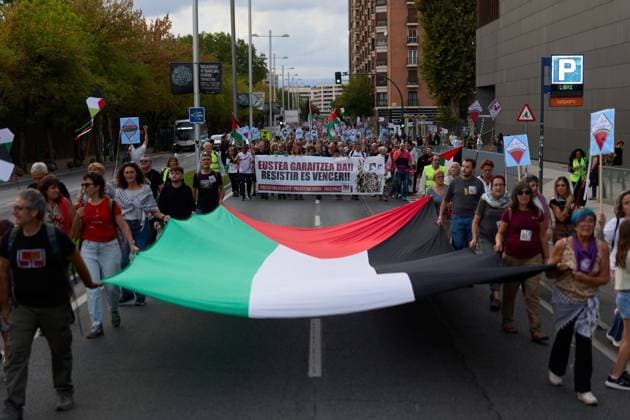 October 3, 2026, Pamplona, Spain: PAMPLONA, SPAIN, OCTOBER 3, 2026: Demonstrators take part in a pro-Palestinian march called by the citizens platform Yala Nafarroa in Pamplona. Protesters carried Palestinian flags and banners expressing solidarity with Gaza, including a large banner reading Stop Genocide, while participants also displayed messages calling for the protection of journalists. Pamplona Spain - ZUMAq101 20261003_zna_q101_125 Copyright: xUnaixBeroizx