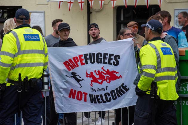 October 3, 2026, Dover, United Kingdom: Far-right protesters hold a banner during a demonstration in Dover. Supporters of the English Defence League (EDL) gathered in Dover, UK to march through the town all the way to the harbour. English Defence League is an extreme far-right and Islamophobic organisation. It was founded by Tommy Robinson (pseudonym of Steven Yaxley-Lennon) in 2009. Dover United Kingdom - ZUMAs197 20261003_aaa_s197_243 Copyright: xKrisztianxElekx