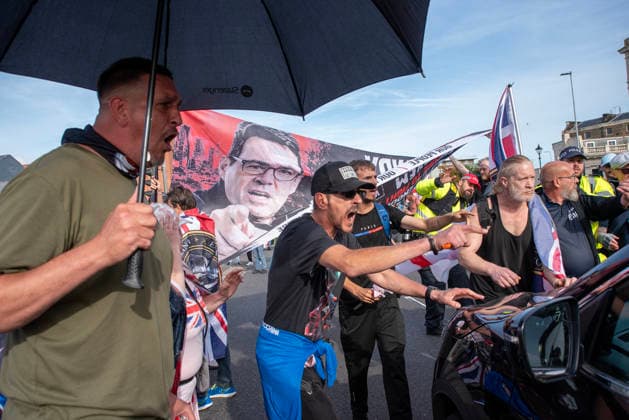 October 3, 2026, Dover, United Kingdom: Far-right protesters shout at a driver who tried to drive through on the crowd during a demonstration in Dover. Supporters of the English Defence League (EDL) gathered in Dover, UK to march through the town all the way to the harbour. English Defence League is an extreme far-right and Islamophobic organisation. It was founded by Tommy Robinson (pseudonym of Steven Yaxley-Lennon) in 2009. Dover United Kingdom  - ZUMAs197 20261003_aaa_s197_248 Copyright: xKrisztianxElekx