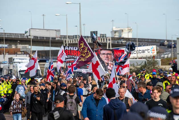 October 3, 2026, Dover, United Kingdom: Far-right protesters march with banner and flags near the harbour during a demonstration in Dover. Supporters of the English Defence League (EDL) gathered in Dover, UK to march through the town all the way to the harbour. English Defence League is an extreme far-right and Islamophobic organisation. It was founded by Tommy Robinson (pseudonym of Steven Yaxley-Lennon) in 2009. Dover United Kingdom - ZUMAs197 20261003_aaa_s197_249 Copyright: xKrisztianxElekx