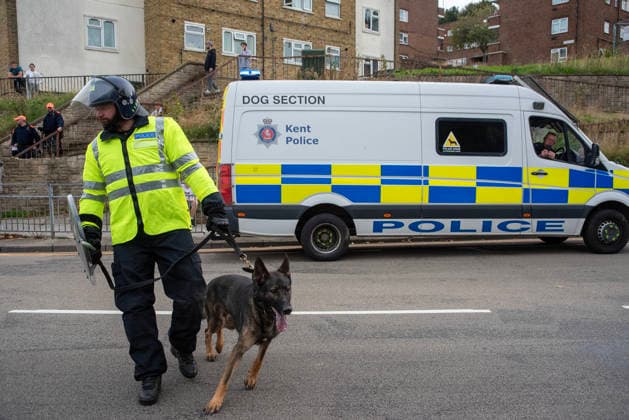 October 3, 2026, Dover, United Kingdom: A member of the police dog unit with his German Shepherd during a demonstration in Dover. Supporters of the English Defence League (EDL) gathered in Dover, UK to march through the town all the way to the harbour. English Defence League is an extreme far-right and Islamophobic organisation. It was founded by Tommy Robinson (pseudonym of Steven Yaxley-Lennon) in 2009. Dover United Kingdom  - ZUMAs197 20261003_aaa_s197_251 Copyright: xKrisztianxElekx