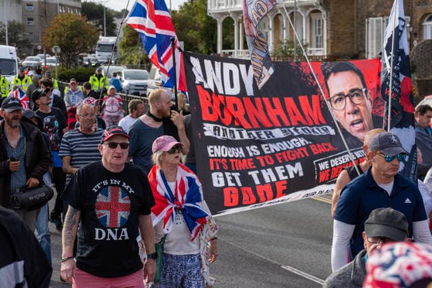 October 3, 2026, Dover, United Kingdom: Far-right protesters march with banner and flags to the harbour during a demonstration in Dover. Supporters of the English Defence League (EDL) gathered in Dover, UK to march through the town all the way to the harbour. English Defence League is an extreme far-right and Islamophobic organisation. It was founded by Tommy Robinson (pseudonym of Steven Yaxley-Lennon) in 2009. Dover United Kingdom  - ZUMAs197 20261003_aaa_s197_256 Copyright: xKrisztianxElekx