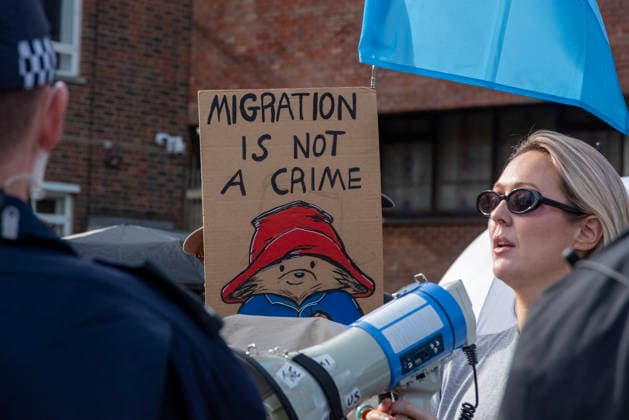 October 3, 2026, Dover, United Kingdom: An antifascist protester holds a placard during a counter-protest in Dover. Supporters of the English Defence League (EDL) gathered in Dover, UK to march through the town all the way to the harbour. English Defence League is an extreme far-right and Islamophobic organisation. It was founded by Tommy Robinson (pseudonym of Steven Yaxley-Lennon) in 2009. Dover United Kingdom - ZUMAs197 20261003_aaa_s197_258 Copyright: xKrisztianxElekx