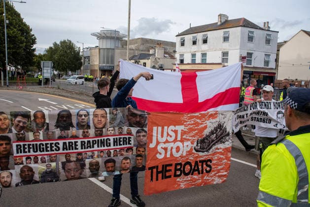October 3, 2026, Dover, United Kingdom: Far-right protesters hold banners and a St George s flag during a demonstration in Dover. Supporters of the English Defence League (EDL) gathered in Dover, UK to march through the town all the way to the harbour. English Defence League is an extreme far-right and Islamophobic organisation. It was founded by Tommy Robinson (pseudonym of Steven Yaxley-Lennon) in 2009. Dover United Kingdom - ZUMAs197 20261003_aaa_s197_257 Copyright: xKrisztianxElekx