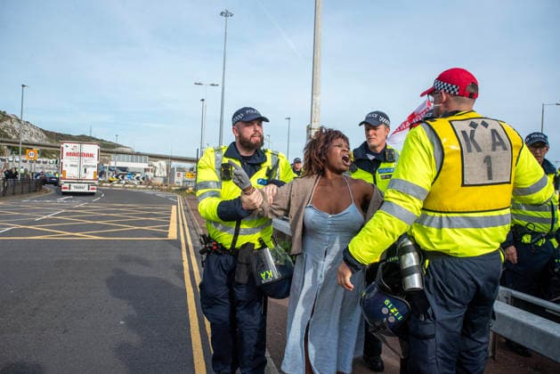 October 3, 2026, Dover, United Kingdom: A bystander angrily shouts at the far-right protesters while the police officers hold her back during a demonstration near the harbour in Dover. Supporters of the English Defence League (EDL) gathered in Dover, UK to march through the town all the way to the harbour. English Defence League is an extreme far-right and Islamophobic organisation. It was founded by Tommy Robinson (pseudonym of Steven Yaxley-Lennon) in 2009. Dover United Kingdom - ZUMAs197 20261003_aaa_s197_261 Copyright: xKrisztianxElekx