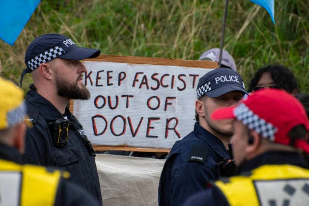 October 3, 2026, Dover, United Kingdom: An antifascist protester holds a placard during a counter-protest in Dover. Supporters of the English Defence League (EDL) gathered in Dover, UK to march through the town all the way to the harbour. English Defence League is an extreme far-right and Islamophobic organisation. It was founded by Tommy Robinson (pseudonym of Steven Yaxley-Lennon) in 2009. Dover United Kingdom - ZUMAs197 20261003_aaa_s197_267 Copyright: xKrisztianxElekx