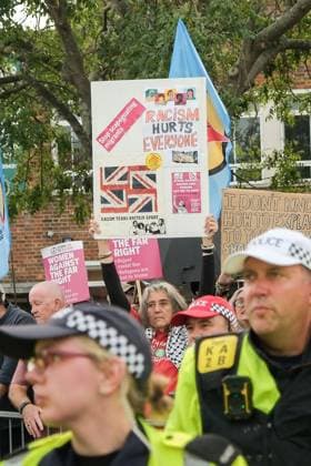 October 3, 2026, Dover, United Kingdom of Great Britain and Northern Ireland: DOVER, UNITED KINGDOM, OCTOBER 3, 2026: Anti-immigration protesters and anti-racism counter-protesters gather during rival demonstrations in Dover, Kent. Anti-immigration demonstrators carrying Union flags and St George s flags displayed banners calling for deportations and an end to small-boat crossings, while counter-protesters gathered nearby. Police maintained a significant presence between the groups and monitored the demonstrations. Dover United Kingdom of Great Britain and Northern Ireland  - ZUMAq101 20261003_zna_q101_204 Copyright: xMarcxLewisx