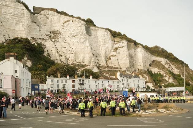 October 3, 2026, Dover, United Kingdom of Great Britain and Northern Ireland: DOVER, UNITED KINGDOM, OCTOBER 3, 2026: Anti-immigration protesters and anti-racism counter-protesters gather during rival demonstrations in Dover, Kent. Anti-immigration demonstrators carrying Union flags and St George s flags displayed banners calling for deportations and an end to small-boat crossings, while counter-protesters gathered nearby. Police maintained a significant presence between the groups and monitored the demonstrations. Dover United Kingdom of Great Britain and Northern Ireland  - ZUMAq101 20261003_zna_q101_205 Copyright: xMarcxLewisx