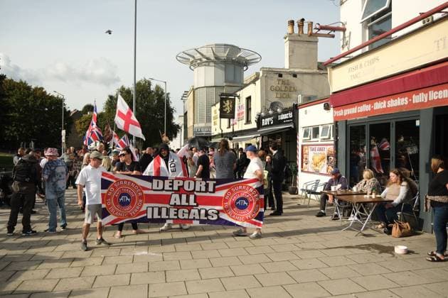 October 3, 2026, Dover, United Kingdom of Great Britain and Northern Ireland: DOVER, UNITED KINGDOM, OCTOBER 3, 2026: Anti-immigration protesters and anti-racism counter-protesters gather during rival demonstrations in Dover, Kent. Anti-immigration demonstrators carrying Union flags and St George s flags displayed banners calling for deportations and an end to small-boat crossings, while counter-protesters gathered nearby. Police maintained a significant presence between the groups and monitored the demonstrations. Dover United Kingdom of Great Britain and Northern Ireland - ZUMAq101 20261003_zna_q101_209 Copyright: xMarcxLewisx