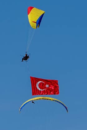 TEKNOFEST Southeast in Turkiye s Sanliurfa SANLIURFA, TURKIYE - OCTOBER 4: Turkish flags are unfurled in the sky during a paramotor demonstration at the Aviation, Space and Technology Festival (TEKNOFEST), world s largest aviation, space, and technology festival at the Sanliurfa GAP Airport for its 15th edition in Sanliurfa, Turkiye on October 4, 2026. Arman Onal Anadolu Sanliurfa Turkey. Editorial use only. Please get in touch for any other usage.  Copyright: x2026xAnadoluxArmanxOnalx