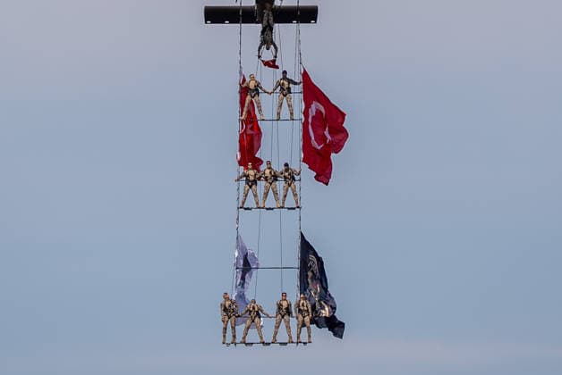TEKNOFEST Southeast in Turkiye s Sanliurfa SANLIURFA, TURKIYE - OCTOBER 4: Soldiers aboard an S-70 helicopter wave Turkish flags during a flag flyover at the Aviation, Space and Technology Festival (TEKNOFEST), world s largest aviation, space, and technology festival at the Sanliurfa GAP Airport for its 15th edition in Sanliurfa, Turkiye on October 4, 2026. Arman Onal Anadolu Sanliurfa Turkey. Editorial use only. Please get in touch for any other usage.  Copyright: x2026xAnadoluxArmanxOnalx