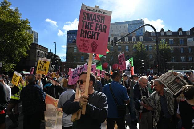 October 4, 2026, London, London, UK: London, UK. Demonstators take part in a march and rally organist by Unite The Union to mark the 90th anniversary of The Battle of Cable Street in the East End of London. All over the country in 1936, Mosley s British Union of Fascists were chased off the streets by a strong working class who knew that the politics of hate and division offers no solutions. The Battle of Cable Street on 4 October 1936 was by far the countryÃ¢â‚¬â ¢s biggest mobilisation against fascism. London UK  - ZUMAl94_ 20261004_zaf_l94_032 Copyright: xRayxTangx