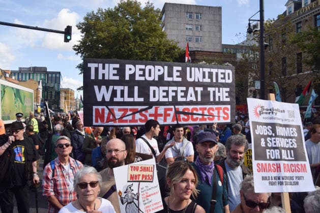 October 4, 2026, London, England, United Kingdom: Protesters gather in Whitechapel during the march to Cable Street against racism and fascism, marking the 90th anniversary since the Battle of Cable Street. London United Kingdom  - ZUMAv130 20261004_zip_v130_006 Copyright: xVukxValcicx