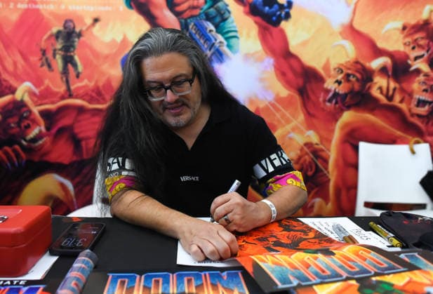 Interview with video game programmer and designer John Romero Image from the interview with video game programmer and designer, John Romero, held as part of the San Diego Comic-Con in Málaga October 4, 2026, in Málaga, Andalusia, Spain Romero is considered one of the most influential figures in the video game industry. He is the co-creator of classics such as DOOM, Quake, Wolfenstein 3D, and Commander Keen. OCTOBER 4, 2026, in Málaga, Málaga, Spain  Copyright: xÃlexxZeax 7820176