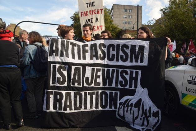 October 4, 2026, London, England, United Kingdom: Protesters hold an Antifascism is a Jewish tradition banner during the march to Cable Street against racism and fascism, marking the 90th anniversary since the Battle of Cable Street. London United Kingdom - ZUMAv130 20261004_zip_v130_008 Copyright: xVukxValcicx