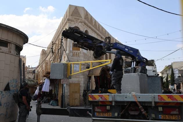 October 4, 2026, Hebron, Palestine, State of: HEBRON, OCCUPIED WEST BANK, OCTOBER 4, 2026: Newly installed Israeli military gates are seen near entrances to Hebron s Old City as Israeli forces impose additional movement restrictions in the area. One of the new iron gates was installed in the Al-Zahid area, a key route connecting neighborhoods of the Old City and providing access toward the Ibrahimi Mosque. Local shop owner Badr al-Tamimi said the restrictions were affecting access to more than 1,000 commercial shops and over 500 homes in the area. Hebron Palestine, State of - ZUMAq101 20261004_zna_q101_061 Copyright: xMosabxShawerx
