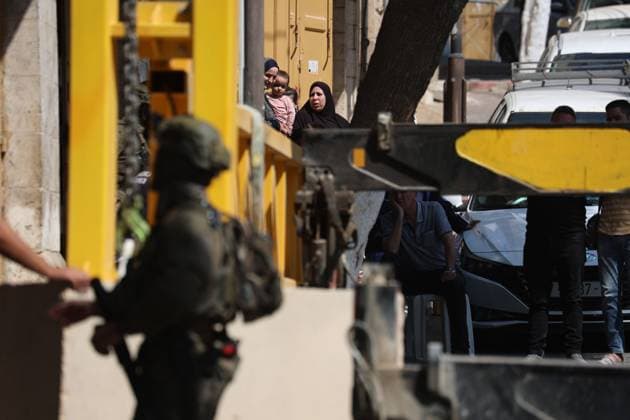October 4, 2026, Hebron, Palestine, State of: HEBRON, OCCUPIED WEST BANK, OCTOBER 4, 2026: Newly installed Israeli military gates are seen near entrances to Hebron s Old City as Israeli forces impose additional movement restrictions in the area. One of the new iron gates was installed in the Al-Zahid area, a key route connecting neighborhoods of the Old City and providing access toward the Ibrahimi Mosque. Local shop owner Badr al-Tamimi said the restrictions were affecting access to more than 1,000 commercial shops and over 500 homes in the area. Hebron Palestine, State of - ZUMAq101 20261004_zna_q101_071 Copyright: xMosabxShawerx
