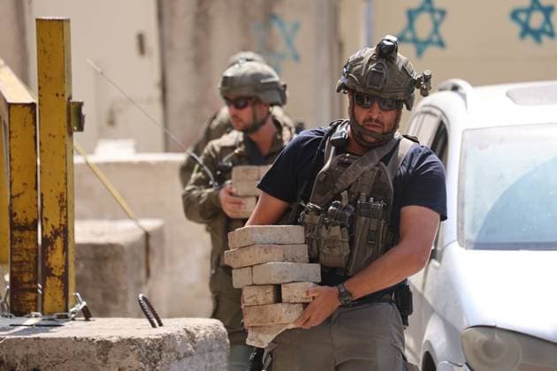 October 4, 2026, Hebron, Palestine, State of: HEBRON, OCCUPIED WEST BANK, OCTOBER 4, 2026: Newly installed Israeli military gates are seen near entrances to Hebron s Old City as Israeli forces impose additional movement restrictions in the area. One of the new iron gates was installed in the Al-Zahid area, a key route connecting neighborhoods of the Old City and providing access toward the Ibrahimi Mosque. Local shop owner Badr al-Tamimi said the restrictions were affecting access to more than 1,000 commercial shops and over 500 homes in the area. Hebron Palestine, State of - ZUMAq101 20261004_zna_q101_075 Copyright: xMosabxShawerx