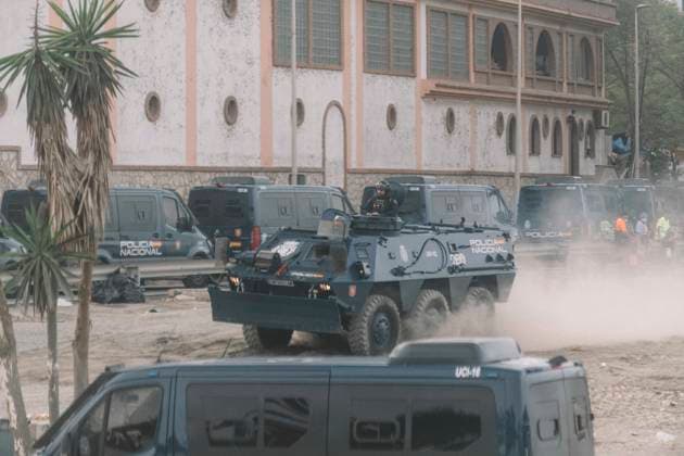 October 4, 2026, Ceuta, Ceuta, Spain: A UIP armoured vehicle raises dust next to police vans during the eviction of the makeshift migrant camp on El Trampolin beach in Ceuta. Spanish National Police began evicting the makeshift camp on El Trampolin beach in Ceuta on October 4, where more than 3,000 migrants, most of them young Moroccan men, were living. Dozens of police vans, armoured vehicles of the Police Intervention Units (UIP), drones and boats took part in the operation. People were taken by bus to the temporary centre at the Tarajal border to be identified, and the authorities plan to clear the beach in phases before October 15. The camp grew after a mass arrival at the end of July 2026 set off a migration and political crisis. Ceut - ZUMAs392 20261004_zip_s392_031 Copyright: xFabianxSuspensivox