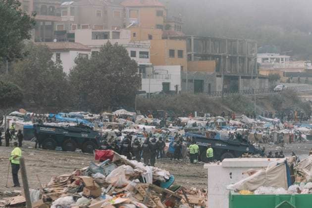 October 4, 2026, Ceuta, Ceuta, Spain: The razed camp, with armoured police vehicles and piles of debris, during the eviction of the makeshift migrant camp on El Trampolin beach in Ceuta. Spanish National Police began evicting the makeshift camp on El Trampolin beach in Ceuta on October 4, where more than 3,000 migrants, most of them young Moroccan men, were living. Dozens of police vans, armoured vehicles of the Police Intervention Units (UIP), drones and boats took part in the operation. People were taken by bus to the temporary centre at the Tarajal border to be identified, and the authorities plan to clear the beach in phases before October 15. The camp grew after a mass arrival at the end of July 2026 set off a migration and political c - ZUMAs392 20261004_zip_s392_028 Copyright: xFabianxSuspensivox