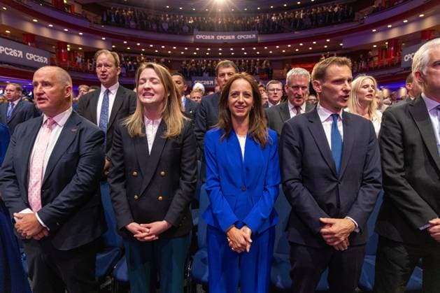 British Conservative Party annual conference 2026, Day 1, Birmingham, UK - 04 Oct 2026 Shadow Secretary of State for Work and Pensions, Helen Whately (center), and Shadow Home Secretary, Chris Philp (to her right) standing in the audience on day one of the British Conservative Party annual conference at the International Convention Centre (ICC) in Birmingham The British Conservative Party holds it’s annual conference at the International Convention Centre (ICC) in Birmingham Birmingham United Kingdom Copyright: xPhilxLewisx xSOPAxImagesx Phil-Lewis-1456320