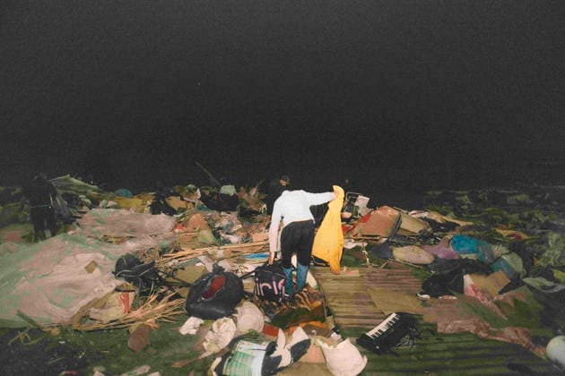 October 4, 2026, Ceuta, Ceuta, Spain: At night, a person searches among the remains of the destroyed tents after the eviction of the makeshift migrant camp on El Trampolin beach in Ceuta. When night fell, people came back to search for their belongings among the destroyed tents. Spanish National Police began evicting the makeshift camp on El Trampolin beach in Ceuta on October 4, where more than 3,000 migrants, most of them young Moroccan men, were living. Dozens of police vans, armoured vehicles of the Police Intervention Units (UIP), drones and boats took part in the operation. People were taken by bus to the temporary centre at the Tarajal border to be identified, and the authorities plan to clear the beach in phases before October 15. T - ZUMAMigr 20261004_zip_s392_042 Copyright: xFabianxSuspensivox