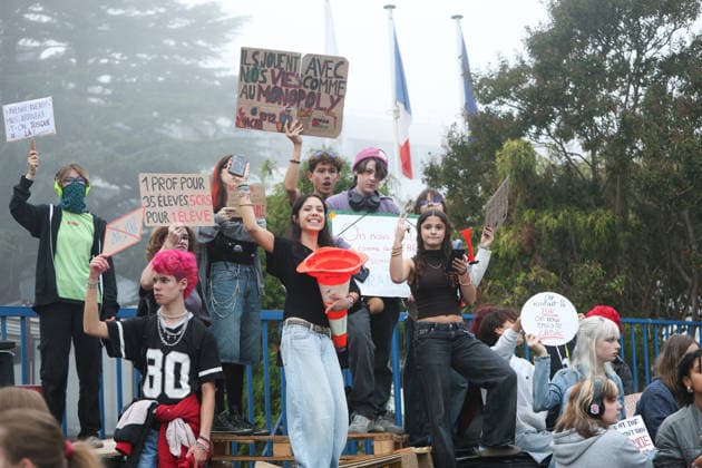 October 5, 2026, Bayonne, Nouvelle Aquitaine, France: High school students hold placards reading They play with our lives like Monopoly , One teacher for 35 students, 5 riot police for 1 student , 8am-6pm crossed out, Future, future, but will we get there? and We wanted the baccalaureate, they send us the BAC , during a protest against the government outside the Reno Cassin high school in Bayonne, southwestern France, on October 5, 2026. Students have been blocking schools across France since September 21 to demand more teachers, smaller classes and better school buildings. Bayonne France - ZUMAb298 20261005_zsp_b298_030 Copyright: xJulesxBuonx