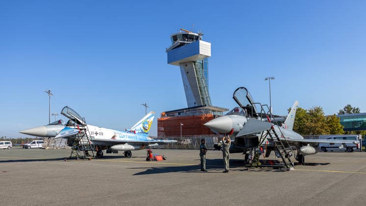 Eurofighters at Nuremberg Airport: German Air Force Conducts Dispersed Operation Drill, Nuremberg, October 5, 2026 Two German Air Force Eurofighters are parked on the tarmac at the airport, with soldiers working on an aircraft in front of them. The German Air Force is testing how Eurofighters and operational forces can temporarily operate out of a civilian airport. Nuremberg Airpor 20261005-286A0280-M4000