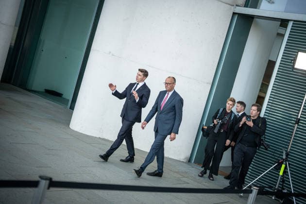 Chancellor Friedrich Merz with his guest Mindaugas Sinkeviciusius, Prime Minister of Lithuania, at the Federal Chancellery; on the terrace of the Federal Chancellery overlooking the Reichstag building, which houses the Bundestag; the Federal Chancellor receives the Prime Minister of the Republic of Lithuania at the Federal Chancellery, Berlin, Germany; Federal Chancellery