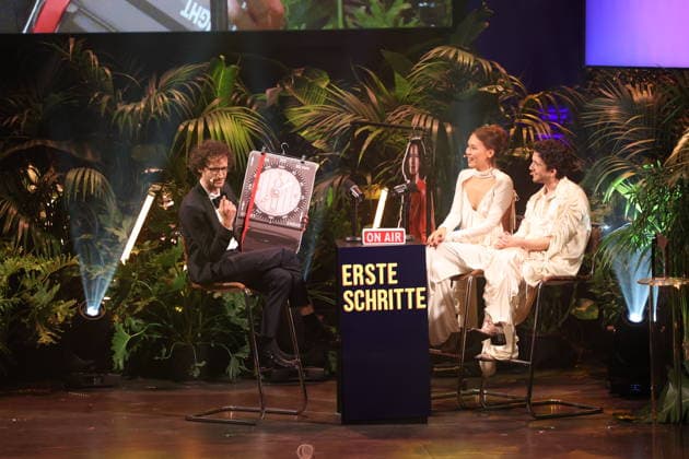 FIRST STEPS 2026: Hosts Malaya and Maximilian; Laudatory Remarks by Karl Schirnhofer; Award Ceremony on Stage at the FIRST STEPS 2026 Awards Ceremony at the Theater des Westens in Berlin Copyright: xEventpressxFuhrx