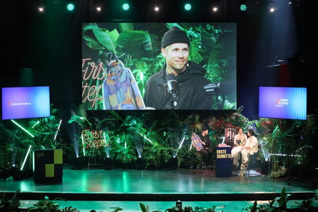 FIRST STEPS 2026: Hosts Malaya and Maximilian, and Hans Block’s laudatory speech for the documentary film award at the FIRST STEPS 2026 awards ceremony on stage at the Theater des Westens in Berlin Copyright: xEventpressxFuhrx