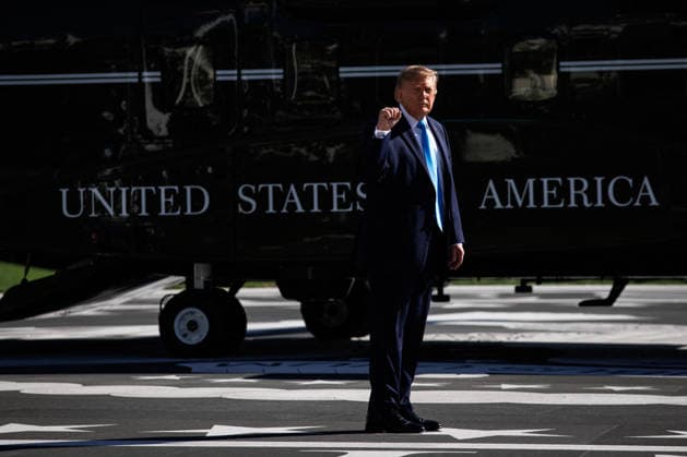 DC: President Trump Departs the White House President Donald Trump turns to gesture towards reporters before boarding Marine One on the South Lawn of the White House on October 5, 2026 in Washington, D.C. Trump is heading to Grand Island, Nebraska where he will speak at a rally for Republican Senator Pete Ricketts. (Photo by Samuel Corum Pool ABACAPRESS.COM) Washington DC United States  Copyright: xPool ABACAx