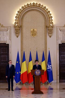 (261005) -- BUCHAREST, Oct. 5, 2026 -- Romanian President Nicusor Dan (R) speaks at a press conference in Bucharest, Romania, Oct. 5, 2026. Nicusor Dan designated Luca Niculescu, state secretary at the Ministry of Foreign Affairs, to form the government on Monday evening, according to Romania s national news agency Agerpres. (Photo by Xinhua) ROMANIA-BUCHAREST-PM-NOMINATION CristianxCristel 