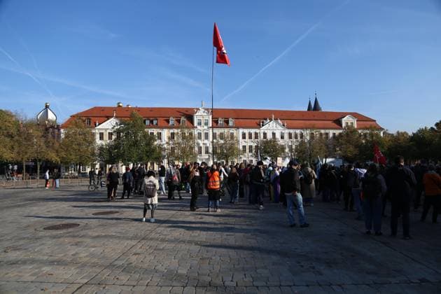 Magdeburg, Saxony-Anhalt, Germany, October 6, 2026: Inaugural session of the state parliament. On Domplatz, demonstrators are gathered in front of the state parliament building to protest against the AfD. Among them is a man carrying an Antifa flag. Copyright: xdtsxNachrichtenagenturx dts_137212