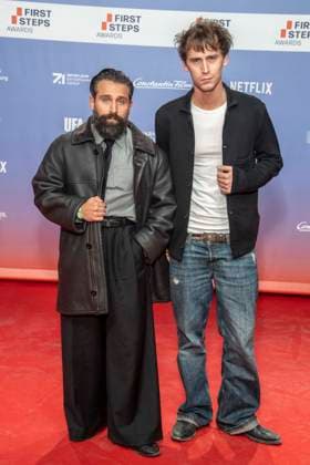 ABB FIRSTSTEPS: Arman Kashani and Oskar Belton on the red carpet at the 2026 FIRST STEPS Awards ceremony at the Theater des Westens on October 5, 2026, in Berlin, Germany