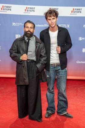 ABB FIRSTSTEPS: Arman Kashani and Oskar Belton on the red carpet at the 2026 FIRST STEPS Awards ceremony at the Theater des Westens on October 5, 2026, in Berlin, Germany