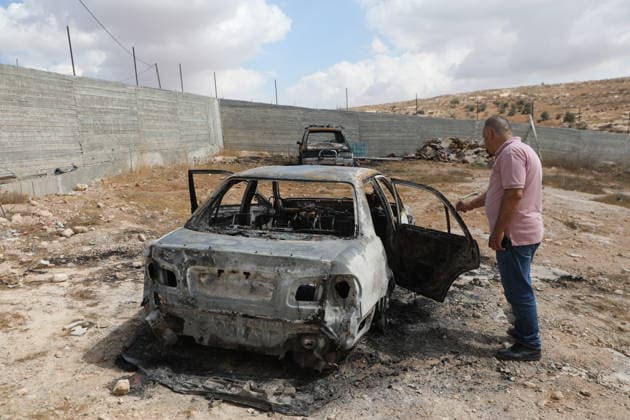 Palestinian Inspects Burned Vehicles Near al-Samu South of Hebron A Palestinian man inspects his burned vehicles near the town of al-Samu, south of Hebron, in the West Bank, on October 6, 2026, after an apparent arson attack believed to have been carried out by Israeli settlers. The incident comes amid an increase in settler attacks on Palestinians and their property in different areas of the West Bank. Photo by Mamoun Wazwaz apaimages Hebron West Bank Palestinian Territory 061026_Hebron_MW_00(1) Copyright: xapaimagesxMamounxWazwazx xapaimagesx