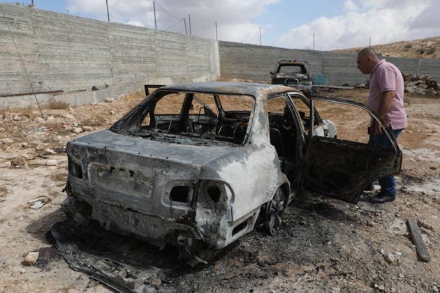 Palestinian Inspects Burned Vehicles Near al-Samu South of Hebron A Palestinian man inspects his burned vehicles near the town of al-Samu, south of Hebron, in the West Bank, on October 6, 2026, after an apparent arson attack believed to have been carried out by Israeli settlers. The incident comes amid an increase in settler attacks on Palestinians and their property in different areas of the West Bank. Photo by Mamoun Wazwaz apaimages Hebron West Bank Palestinian Territory 061026_Hebron_MW_00(2) Copyright: xapaimagesxMamounxWazwazx xapaimagesx
