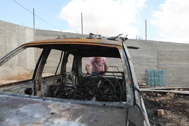 Palestinian Inspects Burned Vehicles Near al-Samu South of Hebron A Palestinian man inspects his burned vehicles near the town of al-Samu, south of Hebron, in the West Bank, on October 6, 2026, after an apparent arson attack believed to have been carried out by Israeli settlers. The incident comes amid an increase in settler attacks on Palestinians and their property in different areas of the West Bank. Photo by Mamoun Wazwaz apaimages Hebron West Bank Palestinian Territory 061026_Hebron_MW_00(6) Copyright: xapaimagesxMamounxWazwazx xapaimagesx