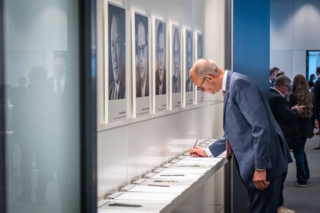 Chancellor Friedrich Merz signs the attendance sheet before the CDU and CSU caucus meeting CDU and CSU caucus meeting in the German Bundestag, Berlin, Berlin, Germany, Bundestag