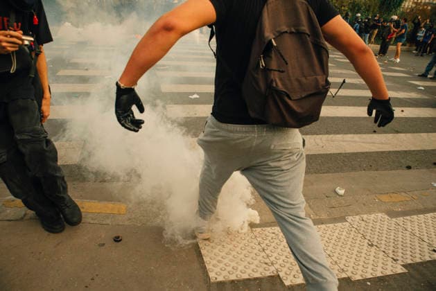 Paris Students Protest Education Conditions A demonstrator runs past a smoking tear gas canister on the pavement in Paris, France, on October 6, 2026. France s Interior Ministry said 256,000 people marched nationwide, including 56,000 in Paris, during the student-led day of action over school conditions. High school students called for more education funding and staff, smaller classes and improved facilities, with teachers, parents and unions joining demonstrations. Paris Ile de France France Copyright: xDavoodxMaeilix