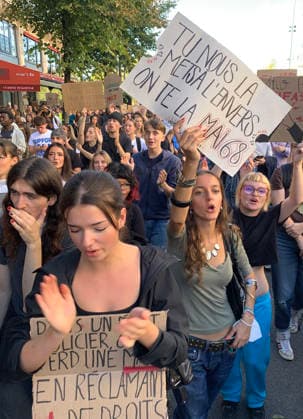 High school students hold placards as they demonstrate in the streets of Paris on Tuesday, October 6, 2026. Hundreds of thousands of students and their supporters took part in nationwide protests across France today to protest school conditions.  PAR20261006117 MAYAxVIDON-WHITE
