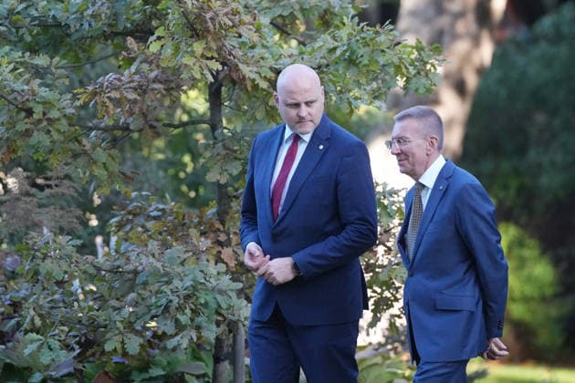 October 7, 2026, Riga, LATVIA: Latvian President EDGARS RINKEVICS (R) and Current Latvian Prime Minister and candidate for Prime Minister of the new government, ANDRIS KULBERGS arrive at the delivery of a statement by Latvian President in Riga, Latvia, 07 October 2026. Riga LATVIA - ZUMAp305 20261007_zip_p305_004 Copyright: xEdijsxPalensx