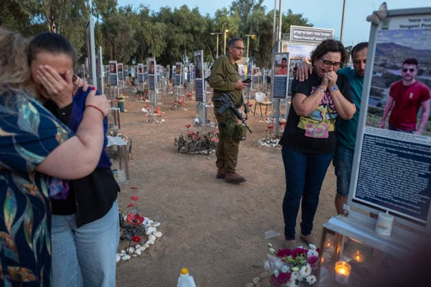 Israelis mourn at sunrise in the Re im memorial on the third anniversary where Hamas massacred 364 people and took another 40 hostages during the Nova dance party on October 7, 2023, near Kibbutz Re im, southern Israel on Wednesday, October 7, 2026. The Hamas cross-border attacks resulted in the deaths of approximately 1,200 people and the abduction of 251 hostages. ISR202606080027 JimxHollander