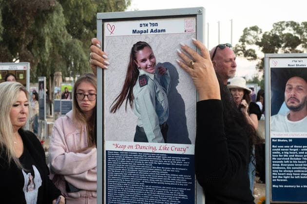 Israelis mourn at sunrise in the Re im memorial on the third anniversary where Hamas massacred 364 people and took another 40 hostages during the Nova dance party on October 7, 2023, near Kibbutz Re im, southern Israel on Wednesday, October 7, 2026. The Hamas cross-border attacks resulted in the deaths of approximately 1,200 people and the abduction of 251 hostages. ISR202606080029 JimxHollander