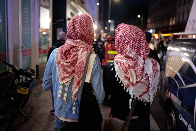 Third anniversary of the Hamas-led October 7, 2023 attack on Israel in Berlin, Germany -7 OCT 2026. Two pro-Palestinian activists seen wearing a traditional Palestinian keffiyeh scarves which have become symbols of protest during a march marking the third anniversary of the Hamas-led October 7, 2023 attack on Israel. Berlin’s assembly authority listed the march under the slogan Down with Colonialism! It was registered to begin at 6 p.m. at Oranienplatz in the Kreuzberg district and proceed via Oranienstrasse, Skalitzer Strasse and Kottbusser Tor toward Hermannplatz. The demonstration was one of several events announced in Berlin for the third anniversary of the October 7, 2023 attack on Israel. The official assembly list also included a Copyright: xVasilyxKrestyaninovx xSOPAxImagesx _VKR5663