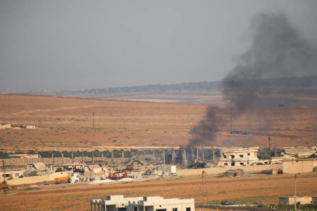 Syria, Aleppo: Smoke following major explosions at a military facility west of Al-Eis
