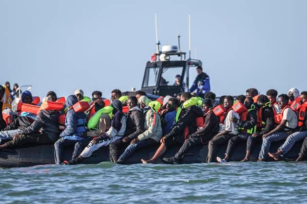 France, asylum seekers on a boat off Merville-Franceville